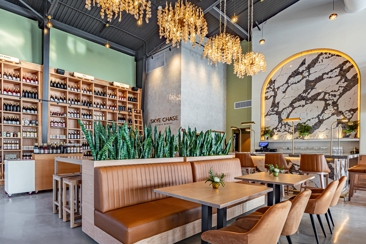 Skye Chase interior with booth seating, wine wall, and altar bar
